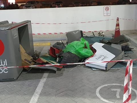The fuel dispenser machine lies destroyed after the crash.