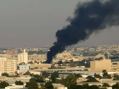 Smoke billows from the fire at a warehouse in Sharjah on Thursday afternoon.