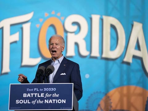 Democratic presidential nominee Joe Biden speaks during a drive-in campaign rally at the Florida State Fairgrounds on October 29, 2020 in Tampa, Florida. Biden is campaigning in Florida on Thursday, with drive-in rallies in Tampa and Broward County.