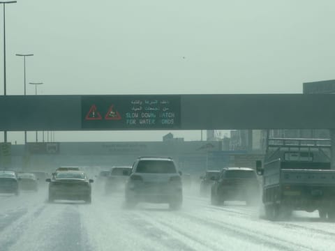 Motorists drive in the rain in Dubai on Sunday. The Dubai Municipality called on everyone to report any accumulation of rainwater using its mobile app.