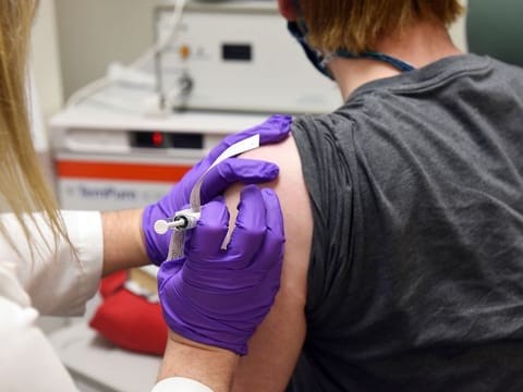 This May 4, 2020, file photo shows the first patient enrolled in Pfizer's COVID-19 vaccine clinical trial at the University of Maryland School of Medicine in Baltimore.