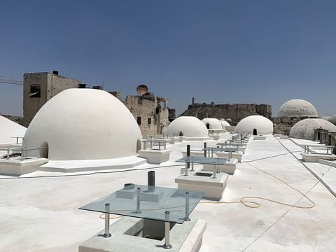The Aga Khan Development Network undertook surveys and technical studies for the rehabilitation of Souq al-Saqatiyya in Aleppo.