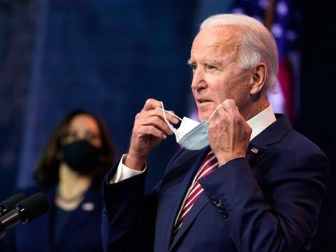 US President-elect Joe Biden, accompanied by Vice-President-elect Kamala Harris, arrives to speak about economic recovery at The Queen theatre on Nov. 16, 2020, in Wilmington, Delaware.
