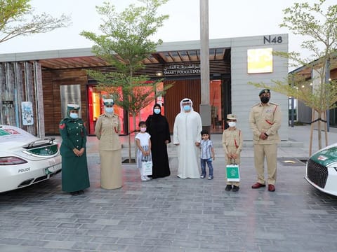 The Dubai Police team with Saood Al Awadi and his family.