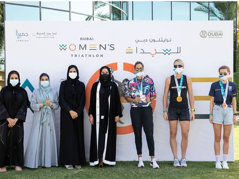 Mona Al Marri poses with winners of the Open category of Dubai Women's Triathlon on Friday.