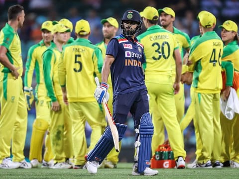 India's captain Virat Kohli (C) reacts as he walks off the ground after being dismissed by Australia's Josh Hazlewood during the second ODI at the Sydney Cricket Ground (SCG) in Sydney on November 29, 2020.