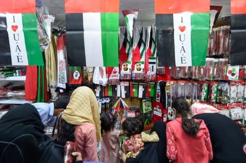 People buy national Flags and accessories at Al Sadiq discounts market in Sharjah, Photo: Ahmed Ramzan/ Gulf News