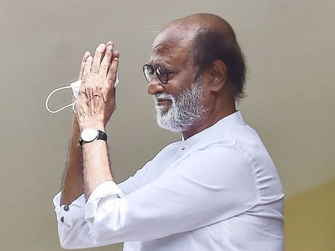 Actor-turned-politician Rajinikanth gestures at his fans after meeting with the senior functionaries of Rajini Makkal Mandram (RMM) to decide on political plunge, in Chennai, on November 30, 2020.