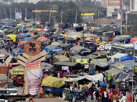 Vehicles of farmers queue up blocking the road during a protest against the new farm laws, at the Singhu Border in New Delhi on Wednesday, December 2, 2020.