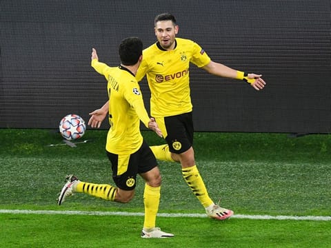 Borussia Dortmund's Raphael Guerreiro celebrates scoring.