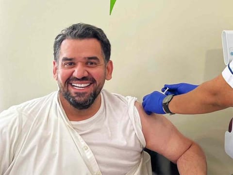 Hussain Al Jassmi, popular Emirati musician, receiving COVID-19 vaccine