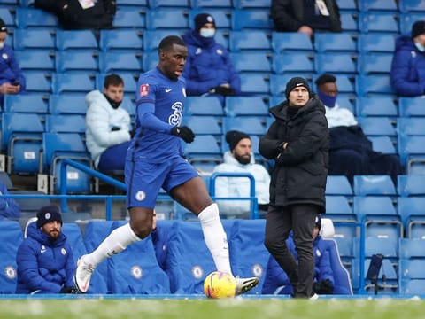 Chelsea's Kurt Zouma in action as Chelsea manager Frank Lampard looks on