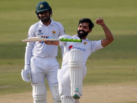Karachi: Pakistan's Fawad Alam, right, celebrates after scoring century while his teammate Faheem Ashraf watches during the second day of the first cricket test match between Pakistan and South Africa at the National Stadium, in Karachi, Pakistan, Wednesday, Jan. 27, 2021