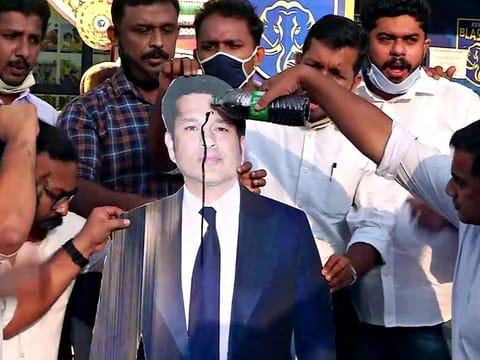 Members of Indian Youth Congress pour black oil on a cut-out of Sachin Tendulkar over his tweet on international personalities tweeting on FarmLaws, in Kochi, last Friday.