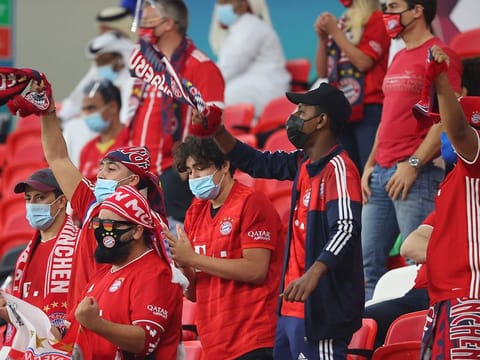 Bayern Munich supporters cheer during the Fifa Club World Cup semi-final against Egypt's Al-Ahly at the Ahmed bin Ali Stadium in the Qatari city of Ar-Rayyan