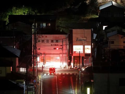 A firefighter vehicle patrols streets following a strong earthquake in Iwaki, Fukushima prefecture, Japan February 13, 2021.