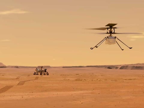 NASA depicts the Ingenuity helicopter on Mars after launching from the Perseverance rover, background left.