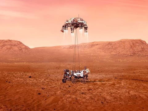 This illustration provided by NASA shows the Perseverance rover, bottom, landing on Mars. Hundreds of critical events must execute perfectly and exactly on time for the rover to land safely on Feb. 18, 2021.
