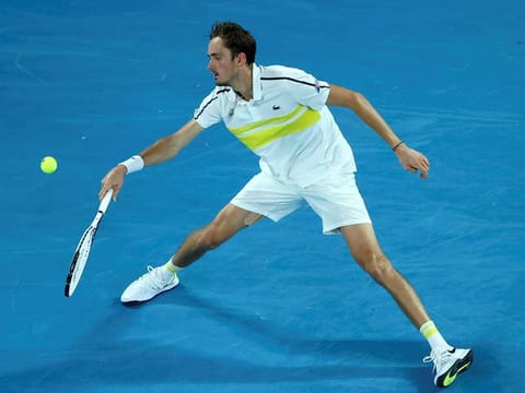 Russia's Daniil Medvedev sends a backhand return against Greece's Stefanos Tsitsipas during their men's singles semi-final match of Australian Open on Friday.