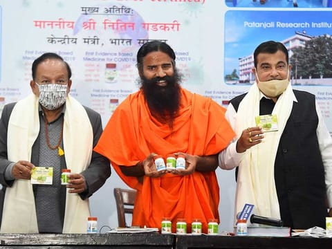 Baba Ramdev releases Patanjali medicine for COVID-19, in the presence of Union Ministers Nitin Gadkari and Dr. Harsh Vardhan, during a press conference in New Delhi, Friday, Feb. 19, 2021.