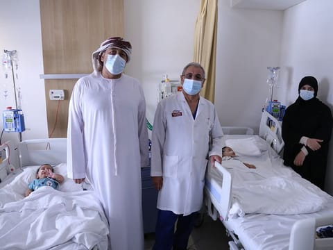 Dr Hussein Matlik with Rashid Al Hasani, Mona Ali and the twin babies.