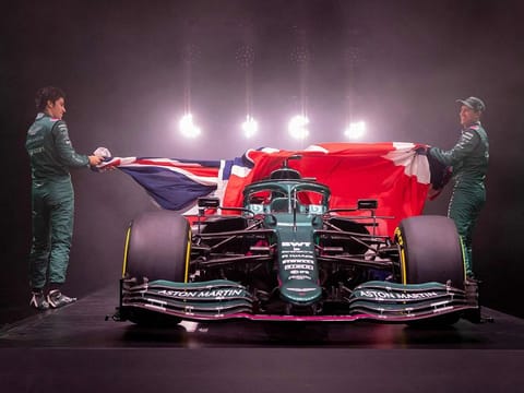 Aston Martin Cognizant Formula One Team's AMR21, their new car for the 2021 Formula One season, being unveiled by drivers Sebastian Vettel (R) and Lance Stroll (L)