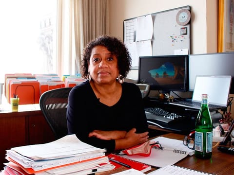 Kimberly Montgomery sits for a photo in her office in City Hall, in Milwaukee. Montgomery lost 15 people in her life to COVID-19. "I don't know if I ever will ever be able to process all of them," she said.