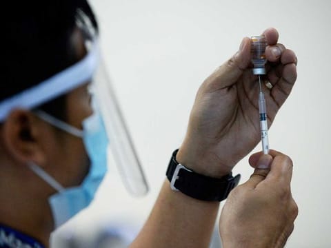 File photo: A health worker prepares a syringe with the Sinovac Biotech's Coronavac vaccine.