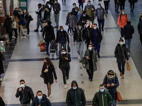 People wearing masks to prevent the spread of the coronavirus walk in a subway hub after work at la Defense business district in Paris, Thursday, March 18, 2021.