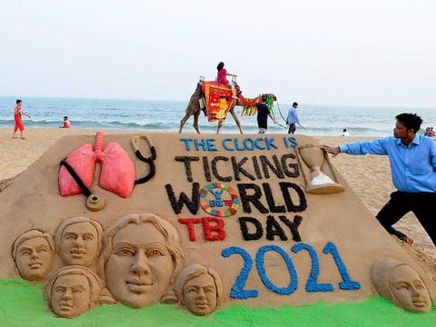 Artist Manas Sahoo makes a sand art to observe 'World TB Day', in Puri, India, on Tuesday, March 23, 2021.