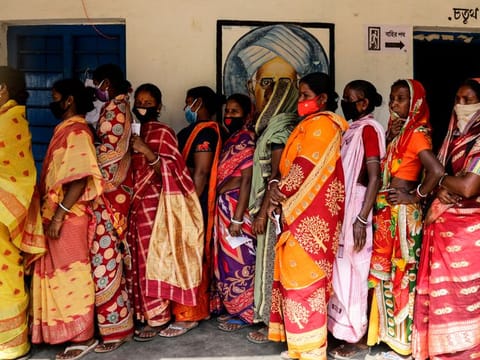 Women voters queue up patiently in Pirakata village of West Bengal, which saw it's first phase of polling for 30 constituencies on Saturday.