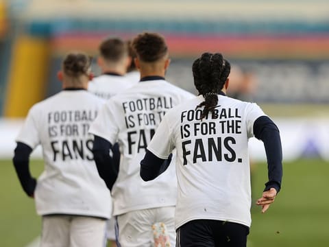 Leeds United players during the warm up before the match wearing UEFA Champions League t-shirts with messages against the Super League.