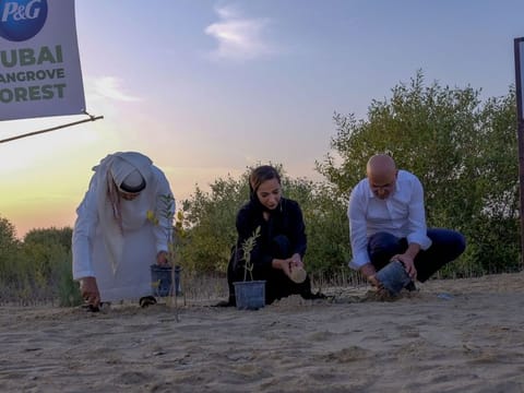 From left: Major Ali Saqar Sultan Alsuwaidi, President, Emirates Marine Environmental Group, Hiba Obaid Al Shehhi, Acting Director of the Biodiversity Department at MOCCAE, and Omar Channawi, CEO of P&G Middle East, East & West Africa and General Export Markets, during the inauguration of the Dubai Mangroves Forest at the Jebel Ali Wildlife Sanctuary on Monday.