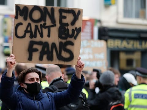 Chelsea fans protest against Chelsea's decision to be included amongst the clubs attempting to form a new European Super League.
