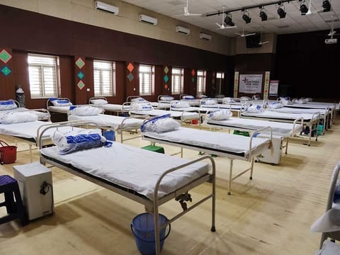 Lines of beds at a makeshift COVID-19 quarantine facility in New Delhi.
