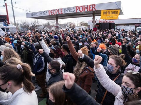 People gather to celebrate at George Floyd Plaza in Minneapolis on Tuesday after hearing that Derek Chauvin was convicted on all three counts against him.