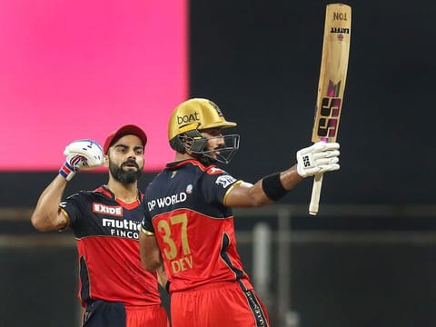 Well played: Virat Kohli (left) lauds Devdutt Padikkal as the latter completes a match-winning century on Thursday.