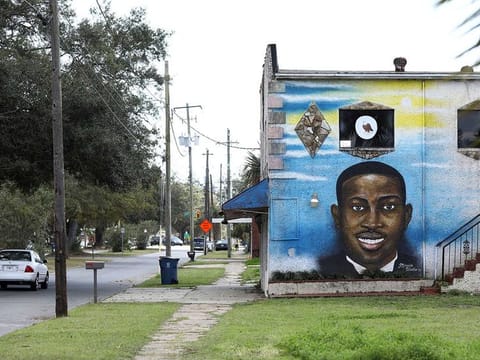 A mural depicts shot Black man Ahmaud Arbery as a Black History Month Memorial Ride is held in memory of those who have died through race-related violence, in Brunswick, Georgia, US, February 27, 2021.