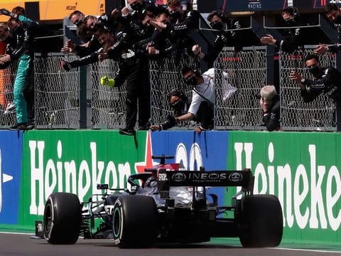 Lewis Hamilton is greeted by the Mercedes team after his win in Portugal