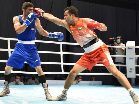 India's Vikas Krishan (right) scored a creditable win against Iran’s Moslem Malamir 4-1 in the 69kg quarter finals on Wednesday.