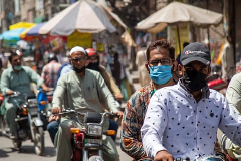 A busy Hall Road in Lahore, Pakistan. Pakistan decided to relax several COVID-19 restrictions, opening schools, restaurants and gyms, after witnessing a significant decline in coronavirus cases since early June.