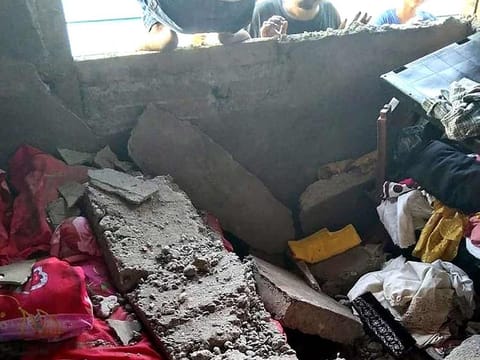 This picture shows a damaged house in Tehoru village, central Maluku, after a 6.1 magnitude earthquake struck off the coast of Indonesia's remote Maluku islands.