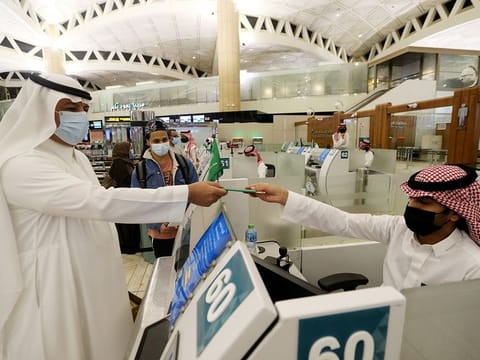 Saudi passengers arrive to King Khaled International airport in the capital Riyadh