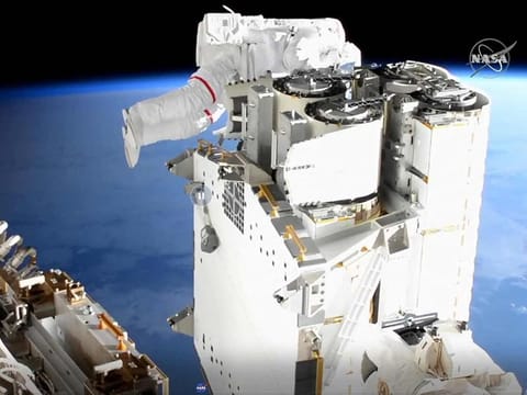 Image shows ESA (European Space Agency) astronaut Thomas Pesquet, checking cables during the ISS Expedition 65 US Spacewalk # 74 to install the First IROSA Solar Array on the P6 Truss for the 2B Channel Power System. N