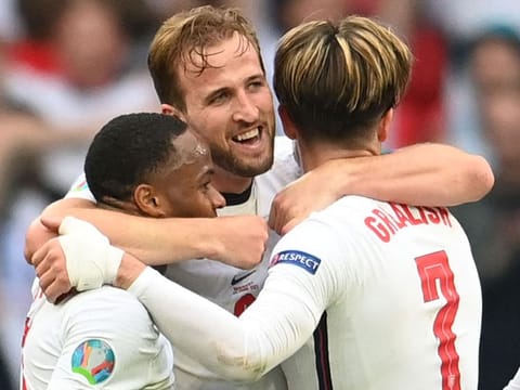 England's Harry Kane celebrates with Raheem Sterling and Jack Grealish after their win over Germany.