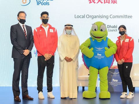 Swimmers Youssef Al Matrooshi and Layla Al Khatib with Brent Nowicki of Fina, Abu Dhabi Sports Council's Aref Hamad Al Awani and Dana the Hawksbill Turtle, to launch the Fina Abu Dhabi World Swimming Championships.