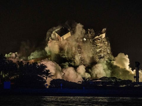 The rest of the Champlain South tower is being demolished in Surfside, Florida, north of Miami Beach, late on July 4, 2021.