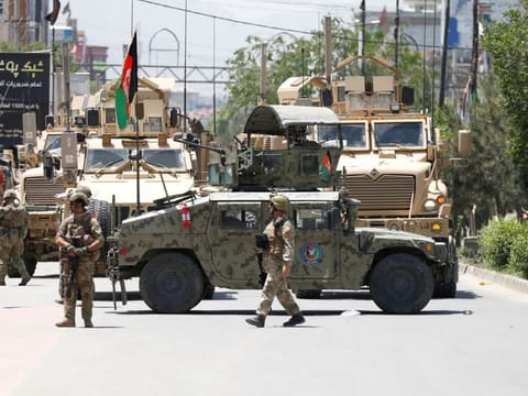 Afghan security forces stand guard outside a hospital which came under attack in Kabul in a file photo.