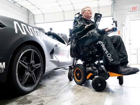 Quadriplegic former IndyCar driver Sam Schmidt, who was paralysed from the neck down in a crash in 2000, is seen alongside his customised Chevrolet Corvette, as part of Arrow Electronics' SAM Car Project, in Nashville, US.