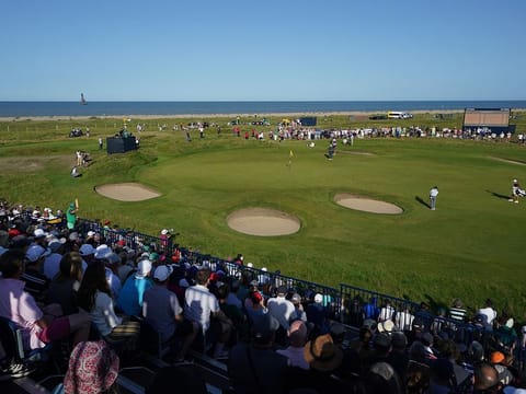 Open leader Louis Oosthuizen putts on the 12th green as Royal St George's bakes in the sun